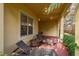 Inviting back porch featuring lounge chairs and a fire pit for relaxation at 264 Seagate Ct, Dunedin, FL 34698