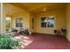 Relaxing back porch area with lounge chairs, ideal for outdoor enjoyment at 264 Seagate Ct, Dunedin, FL 34698
