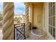 Balcony with decorative columns and black iron railing, providing an outdoor seating area with street views at 264 Seagate Ct, Dunedin, FL 34698