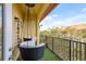 Charming balcony seating with faux grass flooring and a view of lush greenery at 264 Seagate Ct, Dunedin, FL 34698