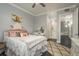 Bedroom with decorative rug and a doorway leading to the bath at 264 Seagate Ct, Dunedin, FL 34698