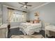 Cozy bedroom with a comfortable bed, soft lighting, and stylish furnishings at 264 Seagate Ct, Dunedin, FL 34698