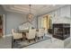 Dining area with fireplace and view to balcony at 264 Seagate Ct, Dunedin, FL 34698