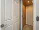 A view of an elevator within the home featuring a white folding door and interior lighting at 264 Seagate Ct, Dunedin, FL 34698