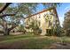 Charming building exterior showcasing lush landscaping and well-maintained grounds at 264 Seagate Ct, Dunedin, FL 34698