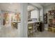 Modern kitchen featuring a wine rack, stylish barstools and an open design concept at 264 Seagate Ct, Dunedin, FL 34698