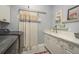 Functional laundry room with washer, dryer, utility sink, and storage, designed for convenience and organization at 264 Seagate Ct, Dunedin, FL 34698