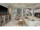 Spacious living room with large TV, fireplace, and elegant decor at 264 Seagate Ct, Dunedin, FL 34698