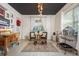 Cozy living room with a black ceiling, bright decor, and light tile floors at 264 Seagate Ct, Dunedin, FL 34698