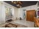 Cozy living room with a black ceiling, bright decor, light floors and eclectic furnishings at 264 Seagate Ct, Dunedin, FL 34698