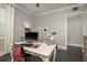Spacious home office with a view, featuring a large desk and natural light at 264 Seagate Ct, Dunedin, FL 34698