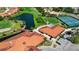Aerial view of the community featuring a golf course, tennis courts, and well-maintained residential properties at 4228 Presidential Avenue E Cir, Bradenton, FL 34203