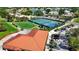 A birdseye view showcases tennis courts, golf course, and lush surroundings in this vibrant community at 4228 Presidential Avenue E Cir, Bradenton, FL 34203