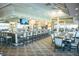 Elegant bar area with ample seating and TV, perfect for social gatherings and relaxation at 4228 Presidential Avenue E Cir, Bradenton, FL 34203