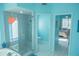 Bathroom with walk-in shower, toilet, and entrance into bedroom at 4228 Presidential Avenue E Cir, Bradenton, FL 34203