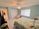 Light and airy bedroom featuring a ceiling fan and neutral decor at 4228 Presidential Avenue E Cir, Bradenton, FL 34203