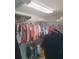 Walk-in closet with shelving and hanging clothes at 4228 Presidential Avenue E Cir, Bradenton, FL 34203