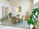 Elegant dining room with chandelier, display cabinet, and serene ambiance at 4228 Presidential Avenue E Cir, Bradenton, FL 34203