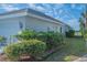 Home exterior showing lush landscaping at 4228 Presidential Avenue E Cir, Bradenton, FL 34203