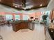 Open-concept kitchen featuring granite countertops, stainless steel appliances, and a view into the living area at 4228 Presidential Avenue E Cir, Bradenton, FL 34203
