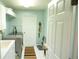 Bright laundry room featuring modern washer and dryer, ample counter space, and access to the outdoors at 4228 Presidential Avenue E Cir, Bradenton, FL 34203