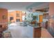 Spacious living room showcasing an open floor plan, fireplace, and seamless flow from the kitchen at 4228 Presidential Avenue E Cir, Bradenton, FL 34203