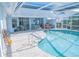 Private pool with an attached spa, poolside seating, and a covered patio, offering relaxation and entertainment at 4228 Presidential Avenue E Cir, Bradenton, FL 34203