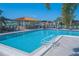 The community pool features a bar area with ample seating and offers views of the lake at 4228 Presidential Avenue E Cir, Bradenton, FL 34203