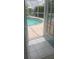 View of the beautiful screened-in pool from the tiled floors of the interior at 4228 Presidential Avenue E Cir, Bradenton, FL 34203