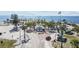 Picturesque beach park with an ocean view, walking area, palm trees, and pavilions at 426 Village Dr, Tarpon Springs, FL 34689