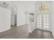 Bright entryway with chandelier lighting, vaulted ceiling, and direct access to other rooms at 426 Village Dr, Tarpon Springs, FL 34689