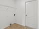 The laundry room features tile flooring and a wire shelf at 426 Village Dr, Tarpon Springs, FL 34689