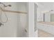 Bright shower room with glass block window and shower bench at 426 Village Dr, Tarpon Springs, FL 34689