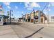 Street view of a commercial property, featuring outdoor seating, decorative lamp posts and unique storefronts at 426 Village Dr, Tarpon Springs, FL 34689