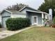 Charming single-Gathering home featuring a well-maintained front yard and covered entry at 4315 Longshore Dr, Land O Lakes, FL 34639