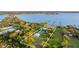 Aerial view outlining a grand estate with waterfront access and lush surrounding landscape at 450 Bayshore Dr, Terra Ceia, FL 34250