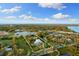 Aerial outlines a waterfront estate with lush landscaping and serene surroundings at 450 Bayshore Dr, Terra Ceia, FL 34250