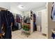 Walk-in closet with organized shelving, hanging racks, and ample storage space for clothing at 450 Bayshore Dr, Terra Ceia, FL 34250