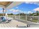 Inviting deck with beautiful views, seating, and a bright, sunny sky at 450 Bayshore Dr, Terra Ceia, FL 34250