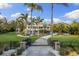 Stunning home with a gated entrance, beautiful landscaping, and a long driveway at 450 Bayshore Dr, Terra Ceia, FL 34250