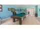 Spacious game room with a pool table, decor, and plenty of room for entertaining at 450 Bayshore Dr, Terra Ceia, FL 34250