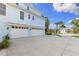 Three car garage and large driveway providing ample parking space and convenience at 450 Bayshore Dr, Terra Ceia, FL 34250
