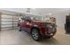Well-lit garage featuring a luxury SUV, offering convenience and secure parking at 450 Bayshore Dr, Terra Ceia, FL 34250