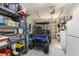 Spacious garage with golf cart and ample storage shelving, perfect for organizing equipment and supplies at 450 Bayshore Dr, Terra Ceia, FL 34250