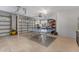 Organized garage with a ping pong table, offering space for hobbies and storage at 450 Bayshore Dr, Terra Ceia, FL 34250
