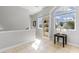 Upstairs hallway with natural light and a built-in display case at 450 Bayshore Dr, Terra Ceia, FL 34250
