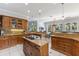 Expansive kitchen showcases custom cabinets, granite counters, dual islands, and a seamless transition to the dining room at 450 Bayshore Dr, Terra Ceia, FL 34250