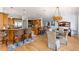Open kitchen and dining area featuring custom cabinetry and stainless steel appliances at 450 Bayshore Dr, Terra Ceia, FL 34250