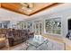 Spacious living room with wood ceiling, large windows, and comfortable seating offering beautiful views at 450 Bayshore Dr, Terra Ceia, FL 34250