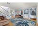 Bright and airy living room with hardwood floors and coastal-themed decor at 450 Bayshore Dr, Terra Ceia, FL 34250
